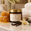 Honey & Vanilla Body Butter in an amber glass jar on a marble bathroom counter